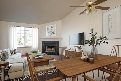 a living room with a dining room table and a fireplace